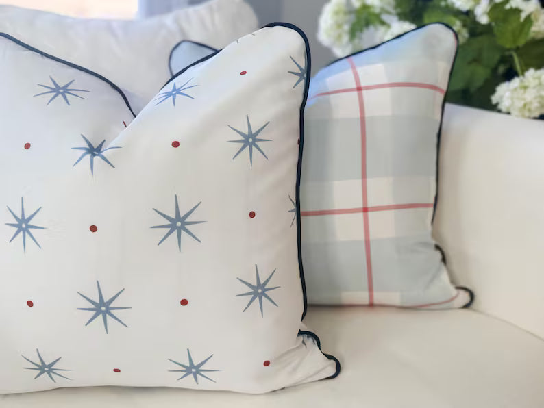 Decorative pillows with star patterns on a sofa